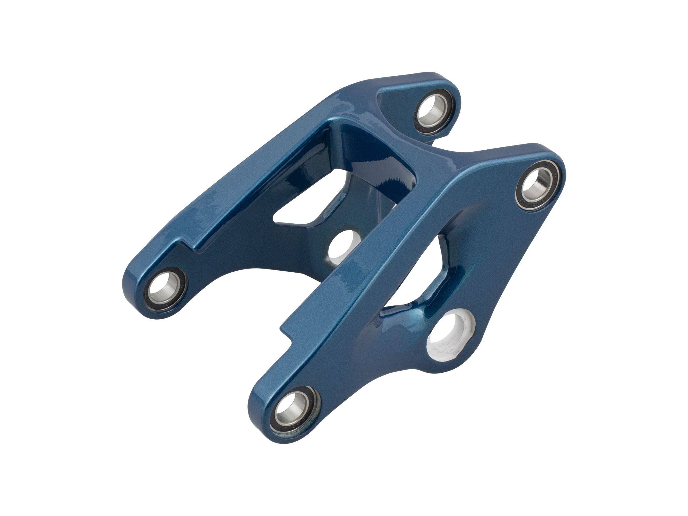 Trek Fuel EX 29 magnesium rocker link component for 2023-2025 carbon frame mountain bikes, showing the durable magnesium part.