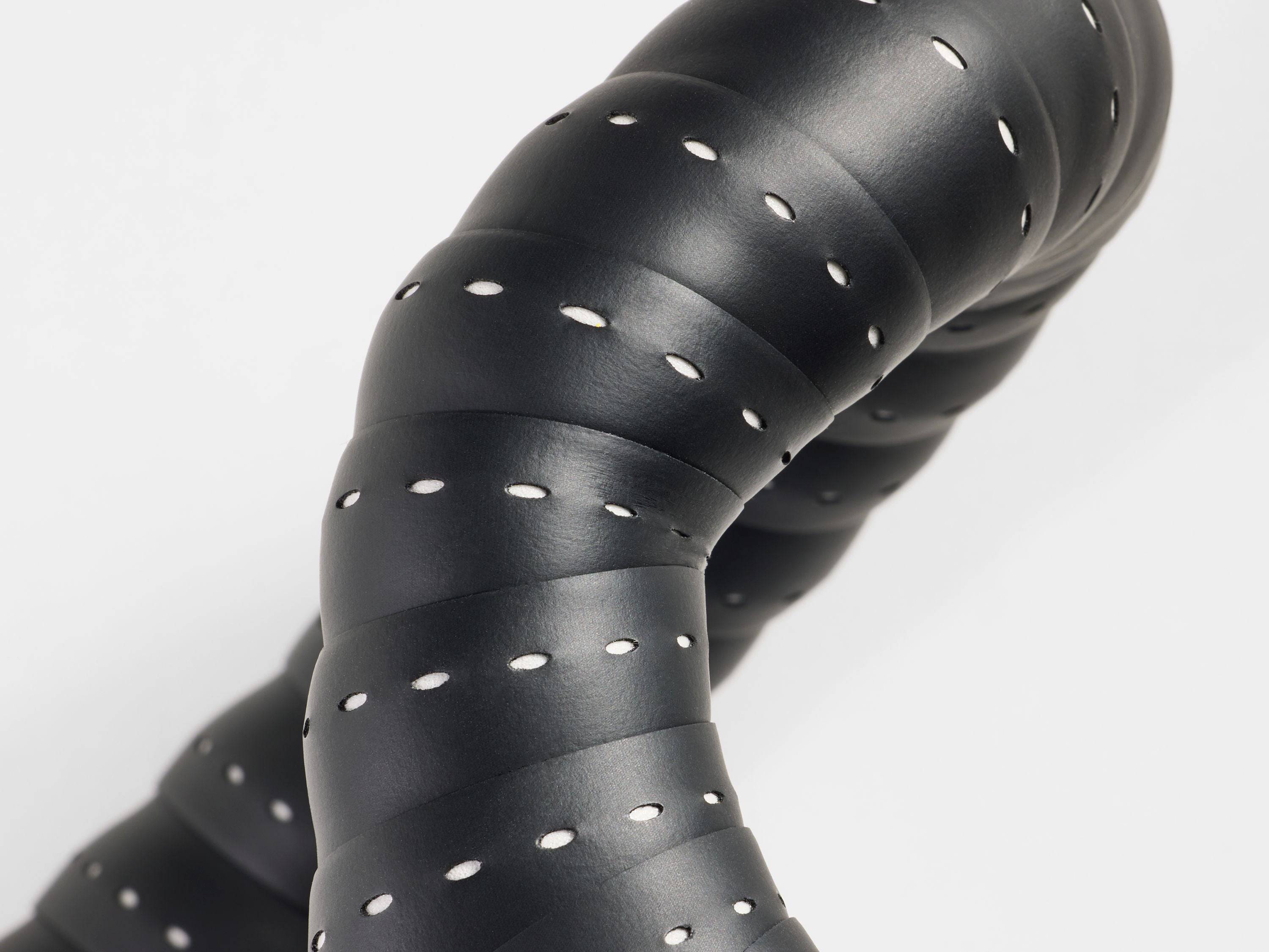Trek Perf Line handlebar tape set for cycling, showing black and red textured grips on bike handlebars.