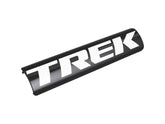 Black and white Trek 2023 electric battery cover, protective component for service access on Trek e-bikes.