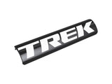 Black and white Trek 2023 electric battery cover, protective component for service access on Trek e-bikes.