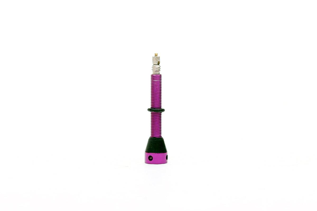 Purple FBI 45mm tubeless valve for secure and airtight seal on tubeless tires, designed for durable automotive wheel components.