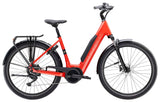 Trek Verve+ 3 Lowstep electric hybrid bike for urban commuting with a comfortable frame and pedal assist in a city setting.