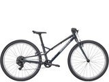 Trek Wahoo 26-inch mountain bike with kid-friendly trigger shifters, suitable for beginner riders, off-road biking adventure.