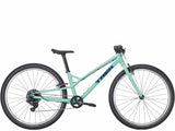 Trek Wahoo 26-inch mountain bike with kid-friendly trigger shifters, suitable for beginner riders, black frame, and rugged tires.