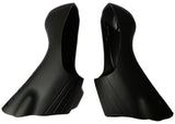Pair of Shimano Dura-Ace ST-9100 bracket covers for shifter protection and replacement, shown in a close-up view.