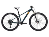 Liv Tempt 1 women's 2024 mountain bike with Shimano CUES U6000 gearing and disc brakes, shown from side view.