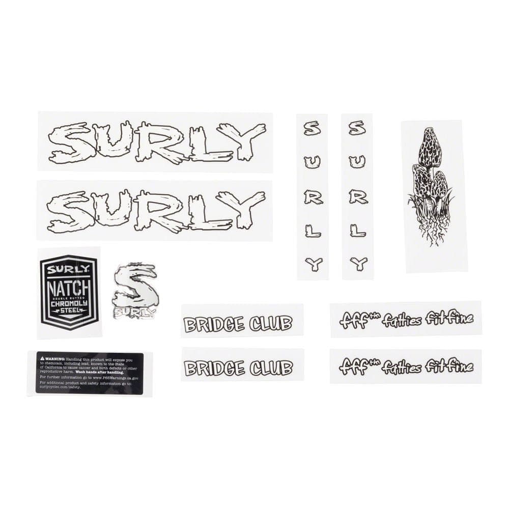 Surly frame and hub adaptor with headbadge for bikes, showing the component and branded headbadge on a neutral background.