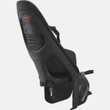 Thule Yepp 2 Maxi MIK HD black child bike seat with click-in mounting system installed on a bicycle.