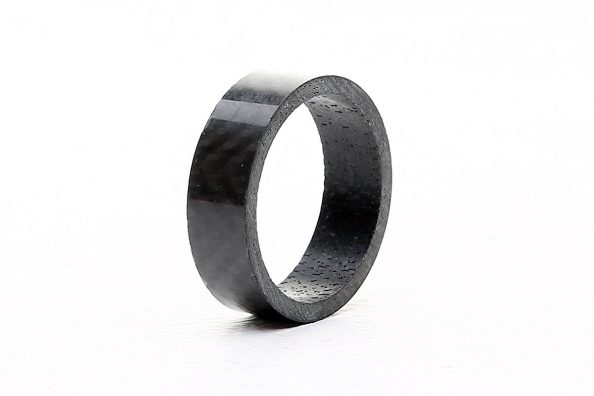 FBI Carbon 1 1/8-inch bike headset spacer, 10mm height, lightweight component for bike headset adjustment, shown in image.