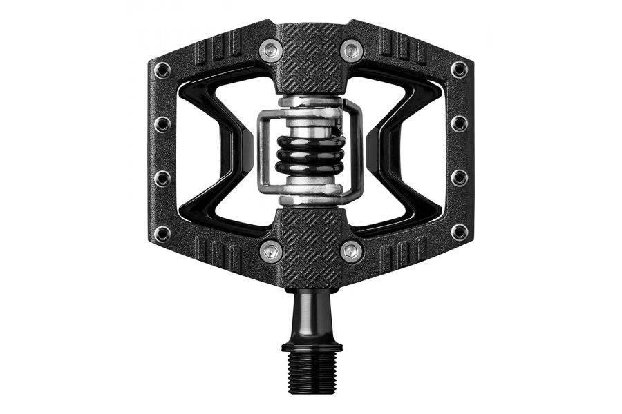 Crank Brothers Double Shot 3 hybrid clipless and flat pedal with adjustable cleats, showing pedal body and cleat mechanism.