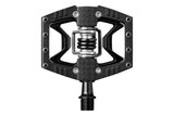 Crank Brothers Double Shot 3 hybrid clipless and flat pedal with adjustable cleats, showing pedal body and cleat mechanism.
