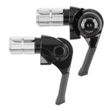 MicroSHIFT MT bar end shifters for mountain bike rear derailleur with indexed and friction modes, mounted on MTB handlebars.