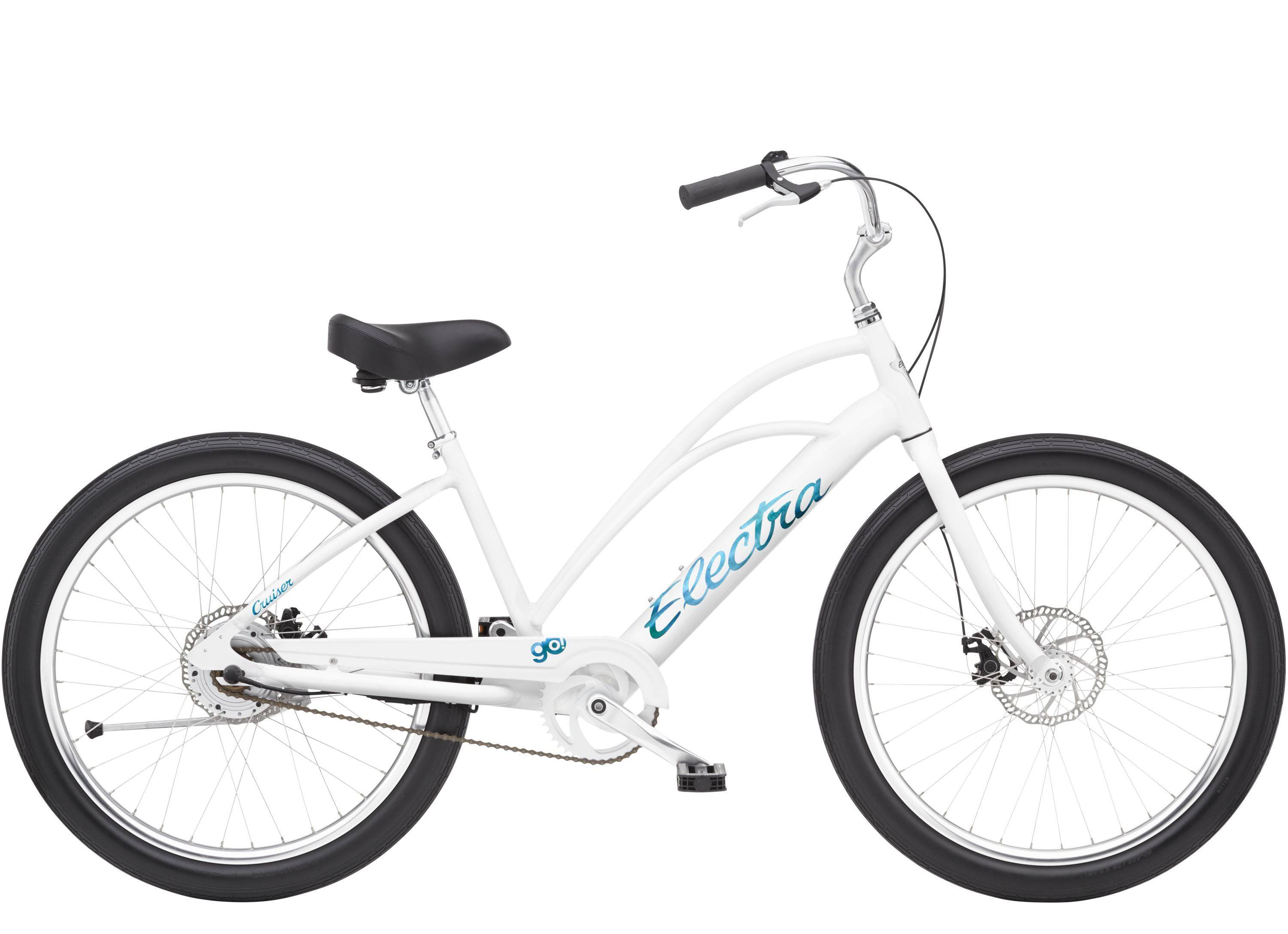 Electra Cruiser Go! Step-Thru e-hybrid bike with pedal assist and flat foot technology, shown outdoors with a city background.