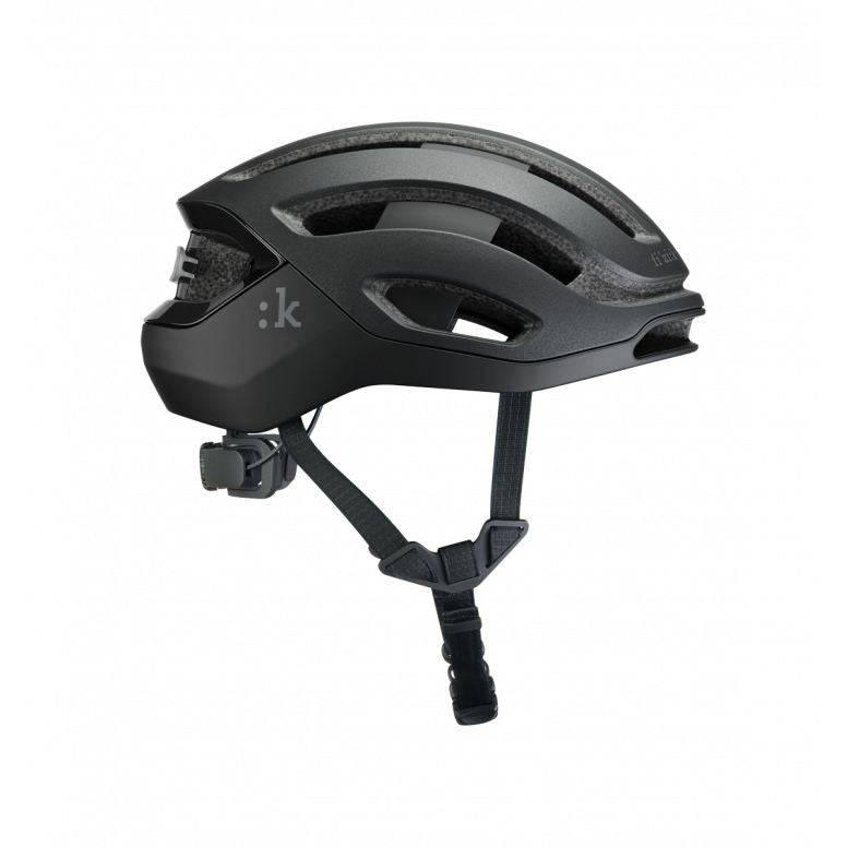 Fizik Kudo cycling helmet with MIPS, ventilation, rear light, lightweight design, and aerodynamic shape for safety and comfort.