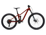 Giant Faith Youth Mountain Bike with FlexPoint suspension and WideGuard wheels, showcasing its rugged frame and off-road tires.