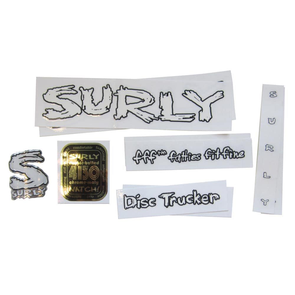 Surly bike decal kits and accessories with authentic headbadge spares for bike frames, displaying various decals and components.