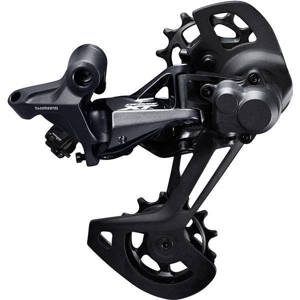 Shimano Deore XT RD-M8120 12-speed MTB rear derailleur with Shadow+ SGS design, mounted on a mountain bike drivetrain.