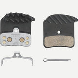 Shimano H03C-MF metal sintered disc brake pads with spring and cooling fins for 4-piston mountain bike brake components.