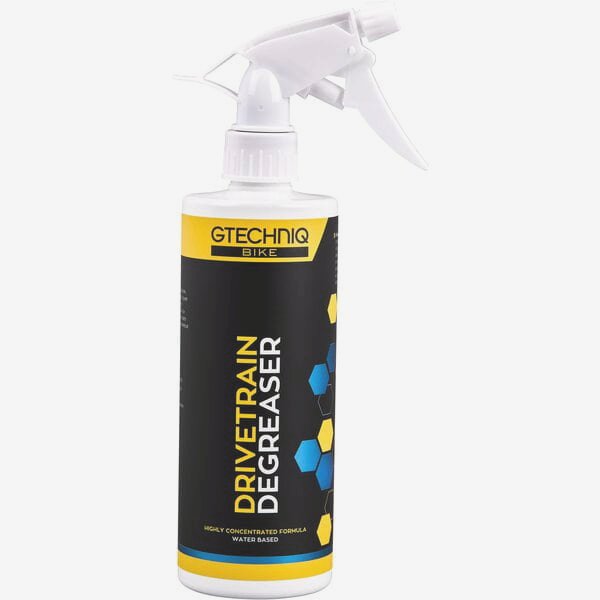 Gtechniq Bike Drivetrain Degreaser biodegradable cleaner for bike chains and cassettes, shown in a workshop setting.