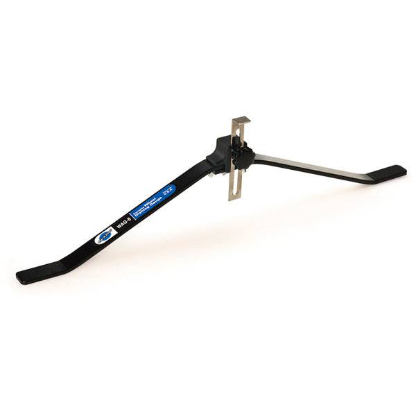 Park Tool WAG-5 portable wheel alignment gauge for 24-29 inch bike wheels, used in workshop settings for accurate bike wheel alignment.