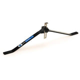 Park Tool WAG-5 portable wheel alignment gauge for 24-29 inch bike wheels, used in workshop settings for accurate bike wheel alignment.
