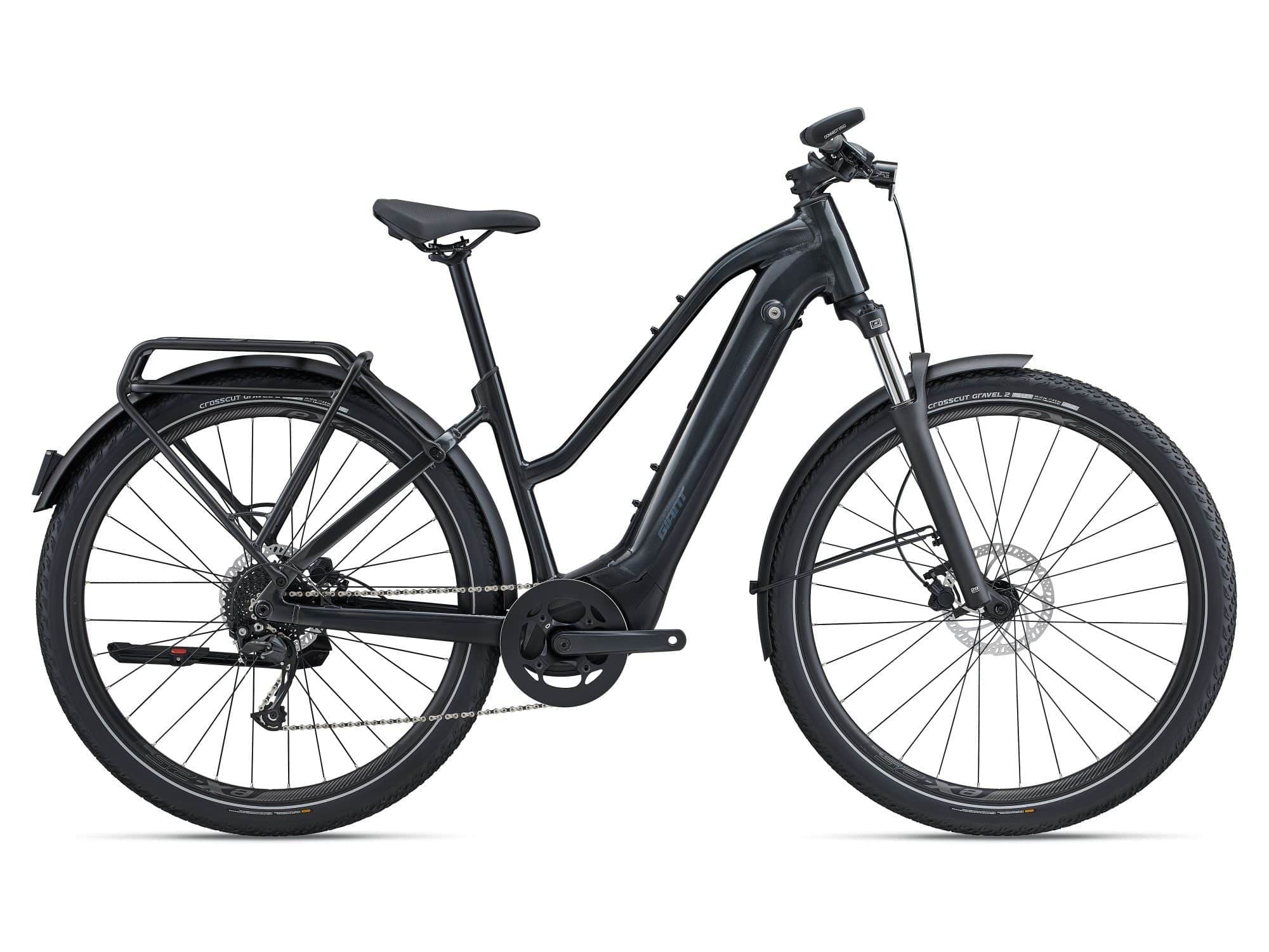 Giant Explore E+ 2 STA 2023 electric hybrid bike with Shimano Alivio drivetrain and disc brakes, showing the bike's frame and wheels.