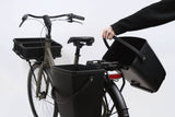 AtranVelo Carry AVS Side Box Pannier with 22L capacity and Triple-X mounting system, shown mounted on a bicycle rack.