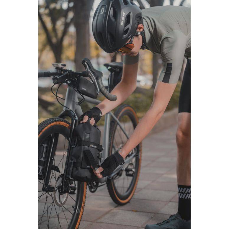 Topeak Fork Drybag 4L weatherproof bikepacking accessory mounted on a bike fork in black color.