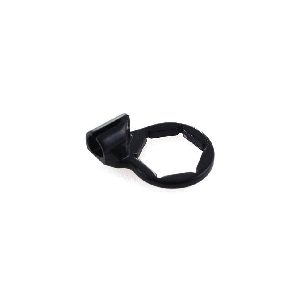 Fox seatpost cable stop actuator for precise dropper seatpost control, shown in a close-up of bike component parts.