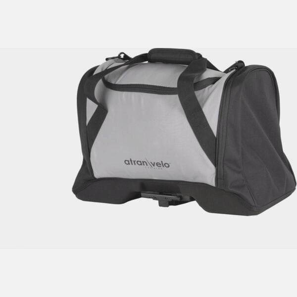 AtranVelo PULSE AVS 36L black duffle bag with reflective accents and AVS mounting system, shown from side angle with adjustable straps.