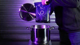Finish Line Halo Hot Wax lubricant melts in a granular form, used for bike chain lubrication in a workshop setting.