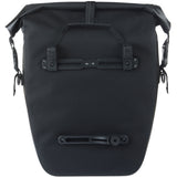 Basil Navigator waterproof single pannier bag with MIK hooks system for bicycle accessories, shown in black with reflective details.