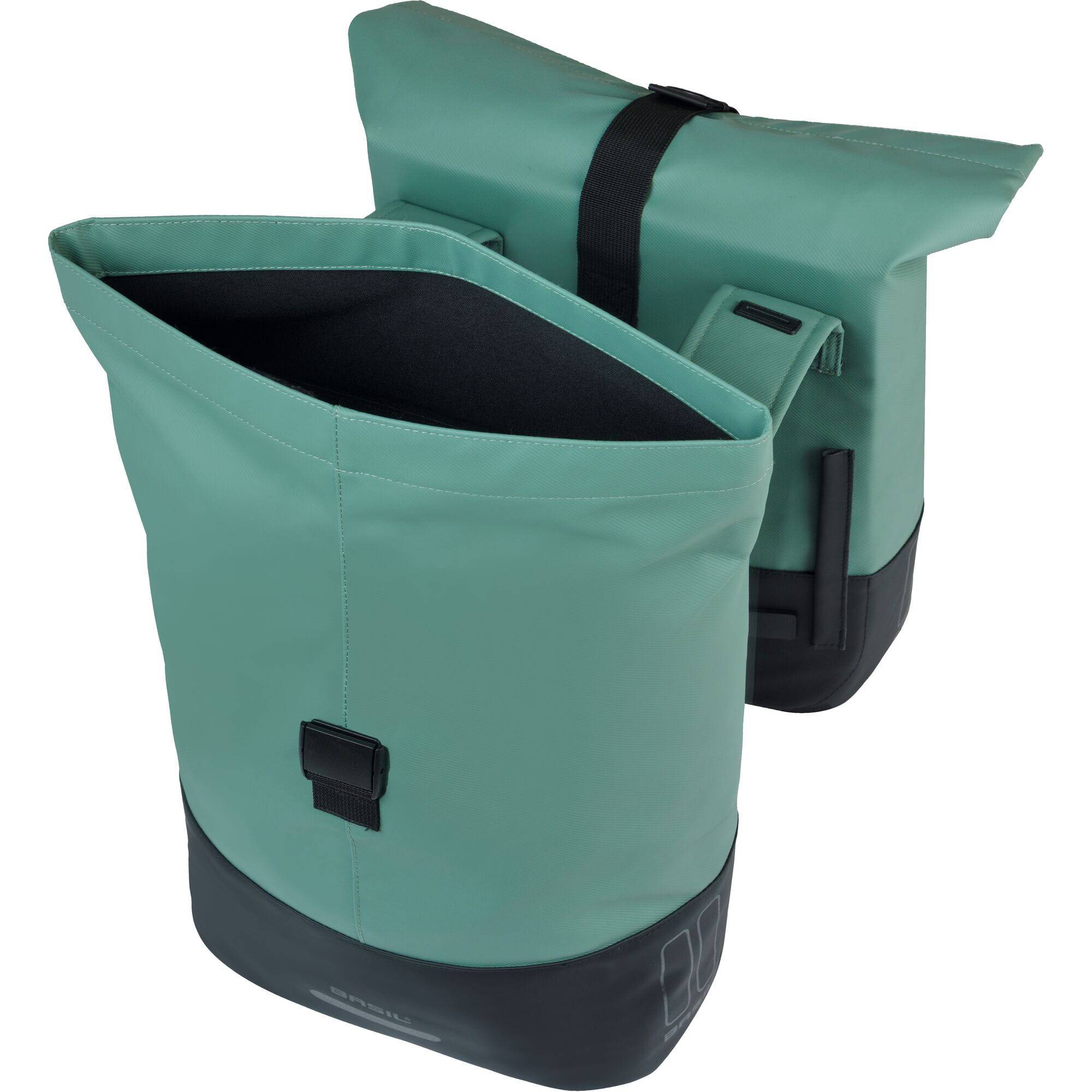 Basil Cove double pannier bag in water-repellent material attached to a bicycle for commuting.