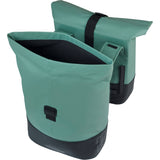 Basil Cove double pannier bag in water-repellent material attached to a bicycle for commuting.