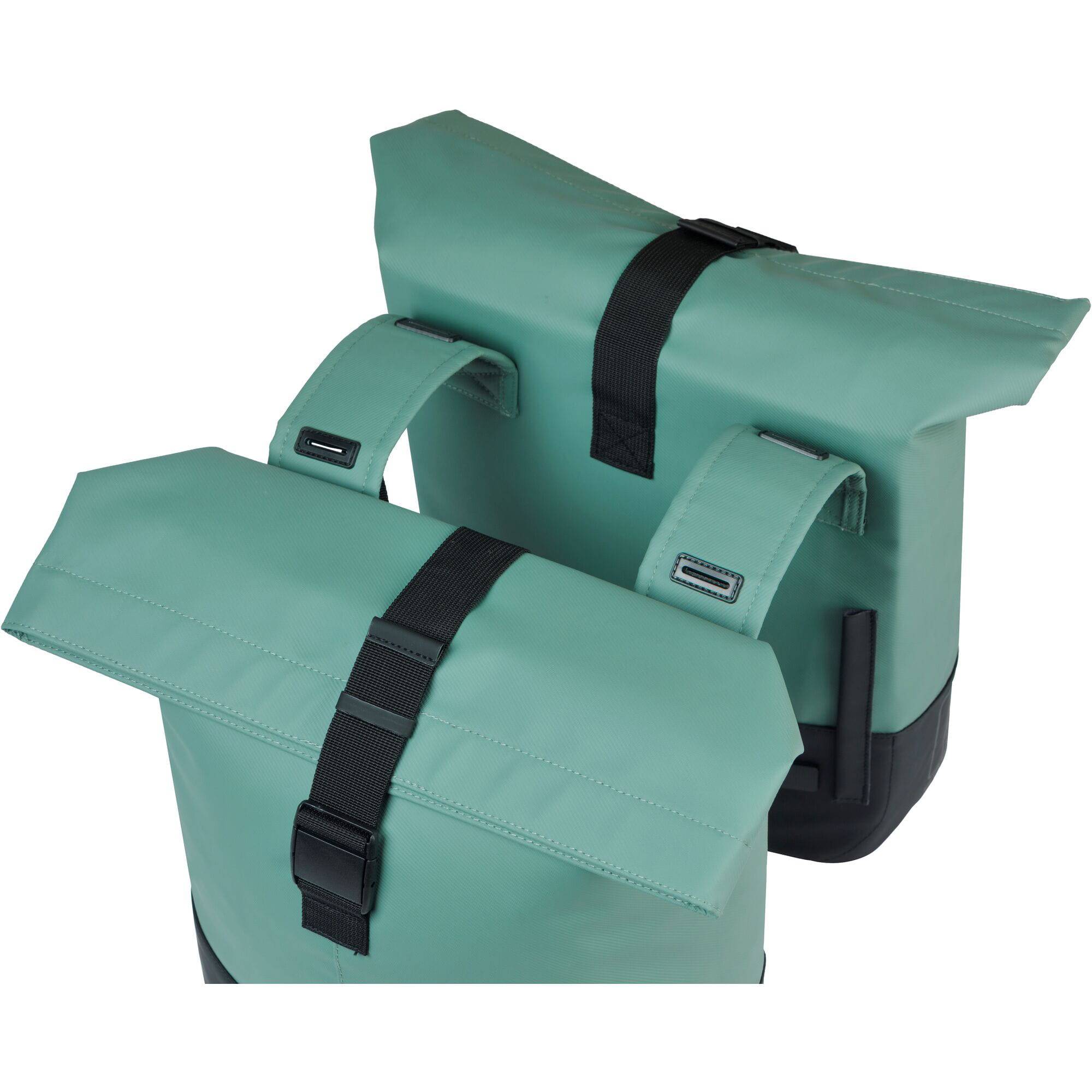 Basil Cove double pannier bag attached to a bicycle, water-repellent bike luggage for commuting, with reflective details.
