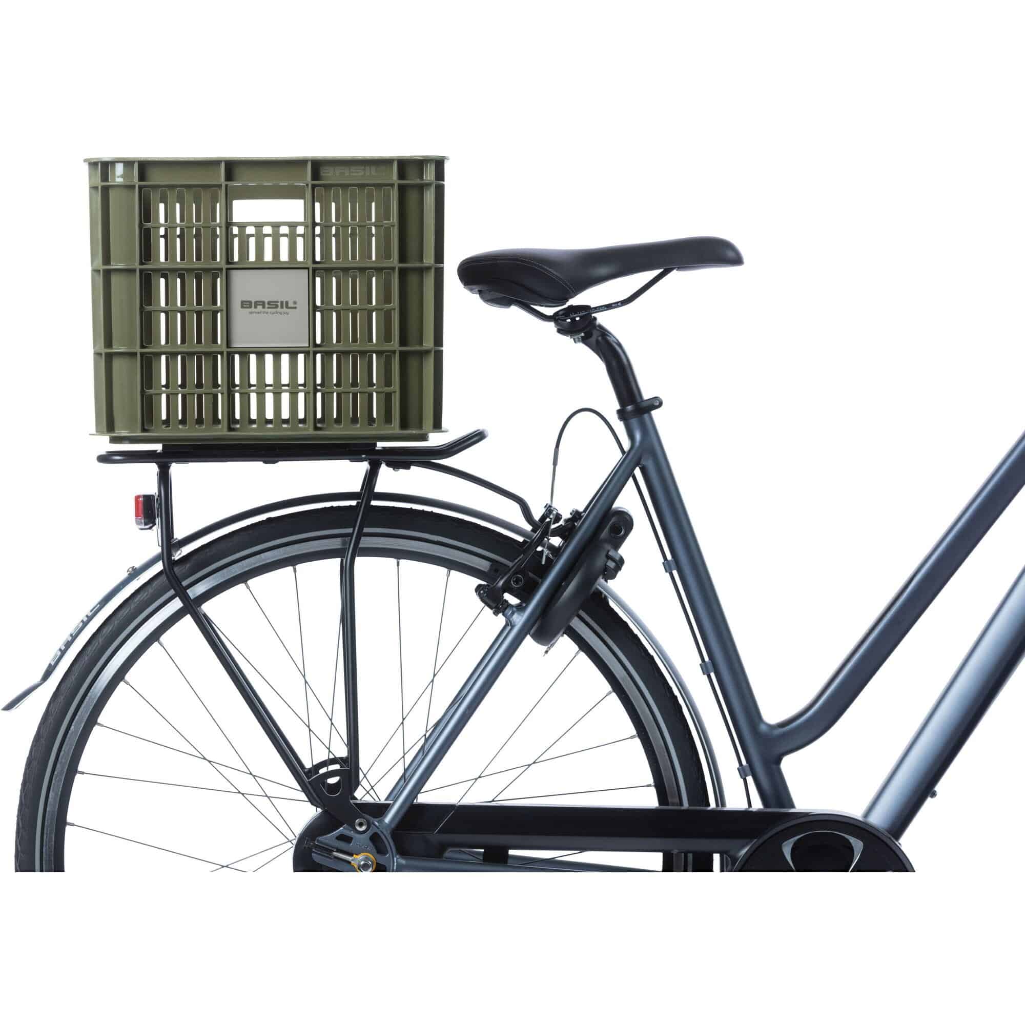 Large green Basil bicycle crate with 40-liter capacity, durable bike cargo basket designed for bike accessories and cargo.