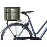 Large green Basil bicycle crate with 40-liter capacity, durable bike cargo basket designed for bike accessories and cargo.