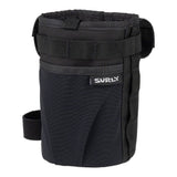 Surly Dugout Feedbag mounted on a bike handlebar, featuring secure attachment and durable design for cycling accessories.