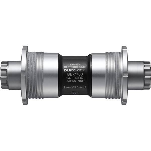 Shimano Dura-Ace BB-7700 Octalink sealed cartridge bottom bracket for road bikes, showing the component with branding visible.