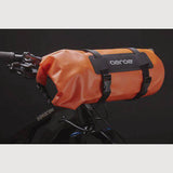 Aeroe Spider Handlebar Cradle bike mount for carrying extra gear, shown attached to a bike handlebar with gear secured.