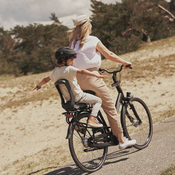 Urban Iki Junior bike seat with carrier mount in Bincho Black, foldable child bike seat for easy attachment and comfort.
