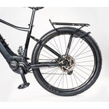 Topeak Tetrarack M2 HD black rear bike rack with QuickTrack™ system mounted on a bicycle for carrying cargo.