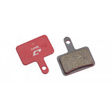 Jagwire Sport semi-metallic disc brake pads for Shimano and Promax systems, featuring red components for bike braking.