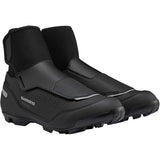 Shimano MW5 MTB shoes with waterproof DryShield membrane, reflective accents, and warm cycling footwear for mountain biking.