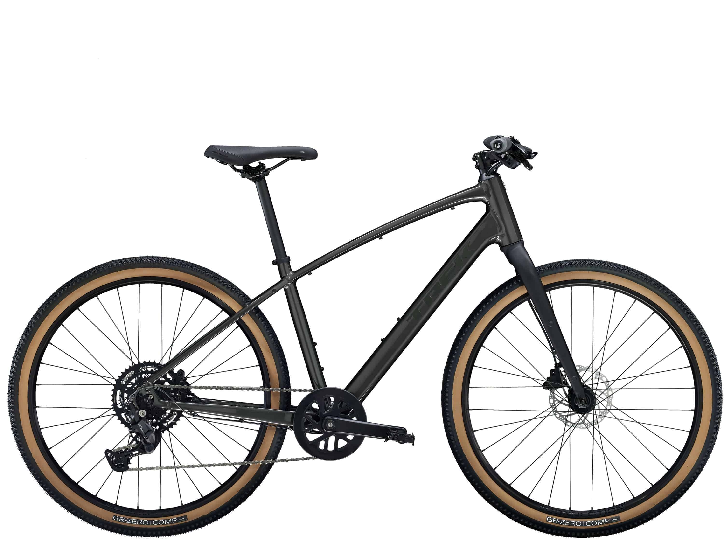 Trek Dual Sport 2 hybrid bike with Shimano 9-speed gears and hydraulic disc brakes, shown outdoors on a trail.