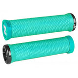 ODI Elite Motion MTB lock-on grips with Version 2.1 clamp system, designed for mountain bike handlebars, shown on a bike.