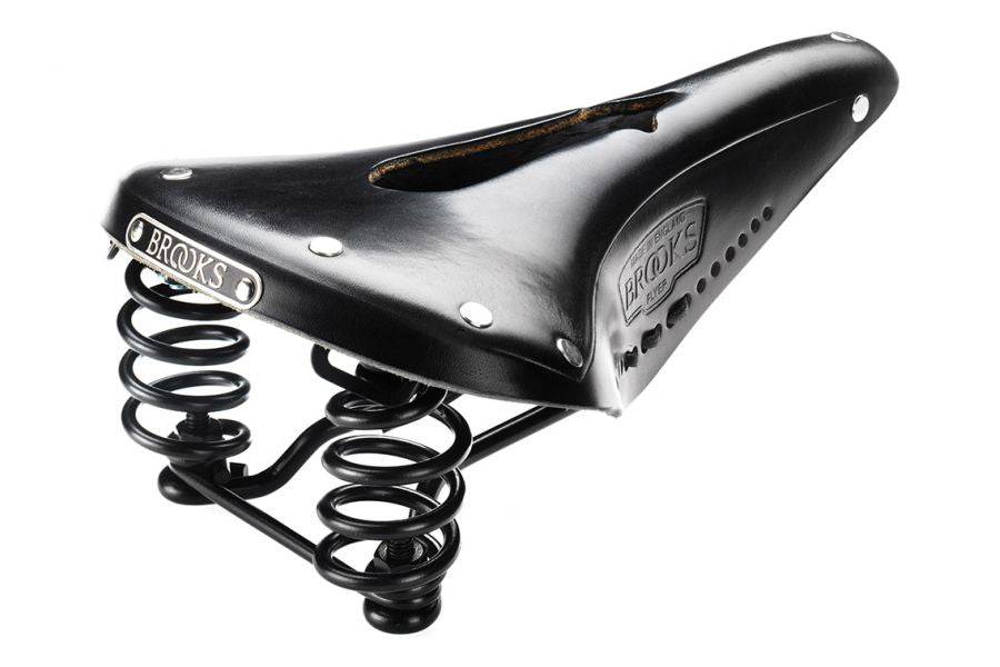 Brooks Flyer carved black steel bike saddle with pressure relief, unisex design, 175mm length, mounted on a bike seat post.