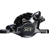 Shimano Deore XT BR-M8200 2-pot hydraulic disc brake caliper for front or rear post mount, black component on bike.