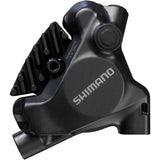 Shimano Deore XT BR-MT805 rear 2-pot flat mount disc brake caliper for bikes, shown with mounting hardware and brake pads.