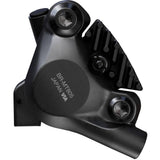 Shimano Deore XT BR-MT805 rear 2-pot flat mount disc brake caliper for bikes, shown in black with mounting hardware.